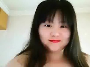 Fat Chinese whore playing with her tits 2